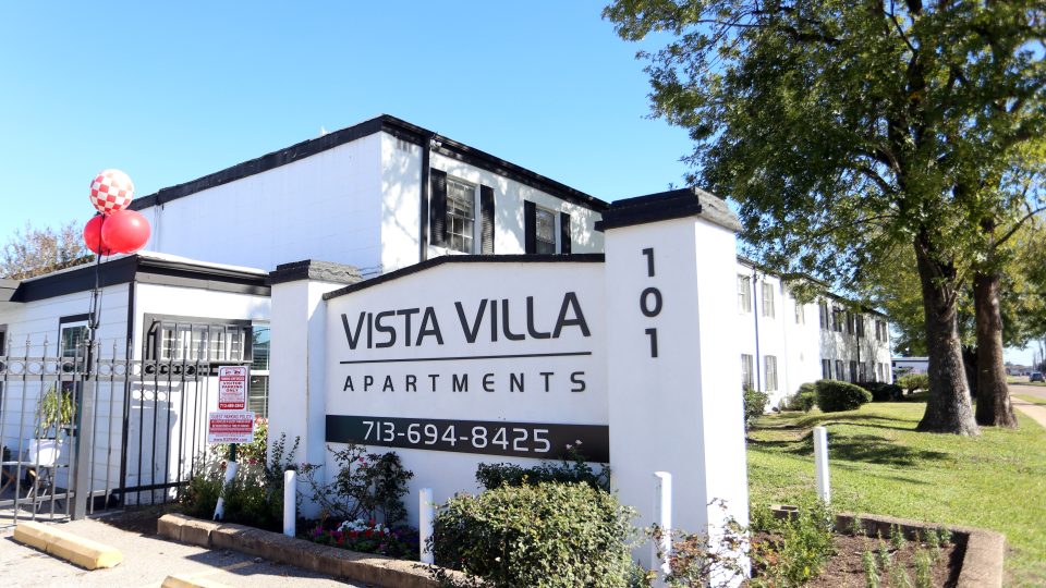 the sign for vista villa apartments is in front of a building at The Vista Villa Apartments