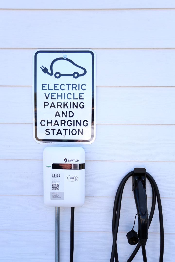 an electric charging station with a sign that says electric car charging station at The Vista Villa Apartments