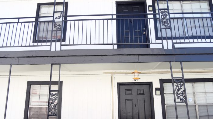 the front of a two story apartment building with balconies at The Vista Villa Apartments