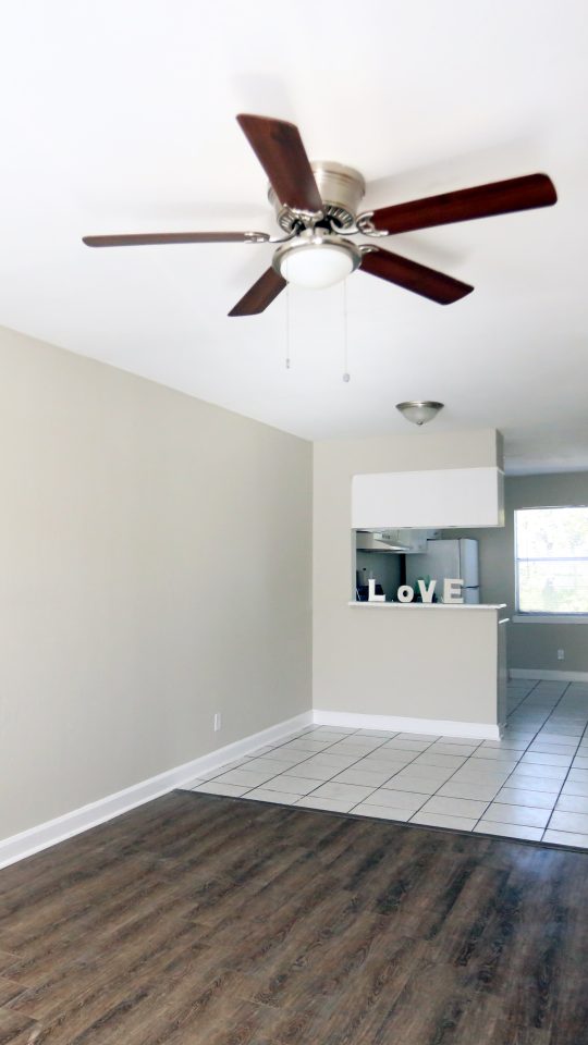 empty room with ceiling fan and hardwood floor at The Vista Villa Apartments